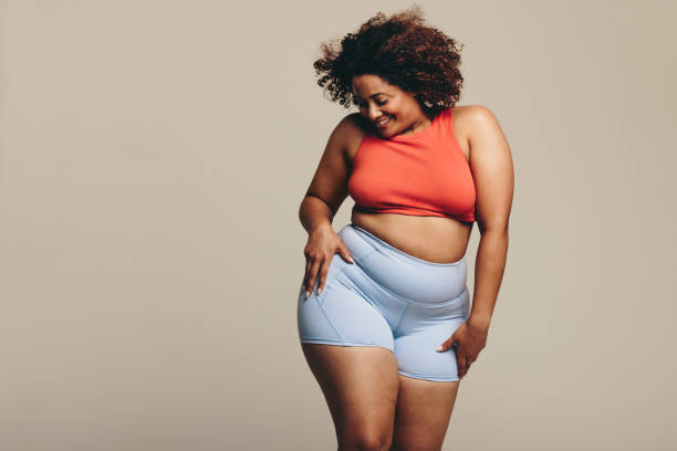 istock Woman celebrating her body positivity through dance in a studio 1489441390