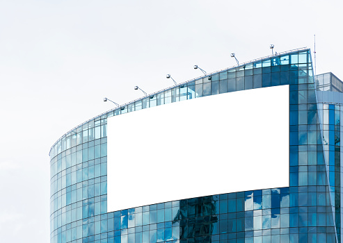 Mock up white large LED display  billboard on tower building .clipping path for mockup