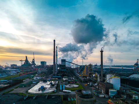 Drone shot of a steel mill in the early morning. Blast furnace and coal depot