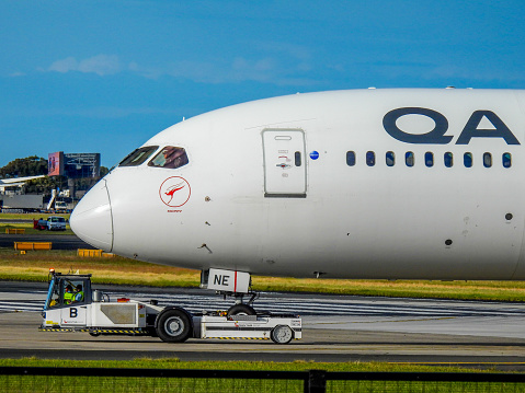 A Qantas Boeing B787-9, registration VH-ZNE, is being towed from the international terminal to the maintenance area of Sydney Kingsford-Smith Airport.  Each Qantas plane is given a uniquely Australian name and she has been given the name \