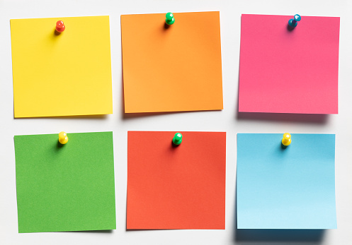 Group of colorful Sticky notes on white paper background. Thif file is cleaned and retouched.