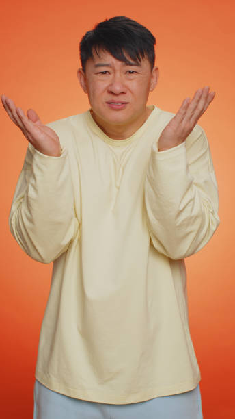 istock Man raising hands in indignant expression ask why what reason of failure demonstrating disbelief 1489453909