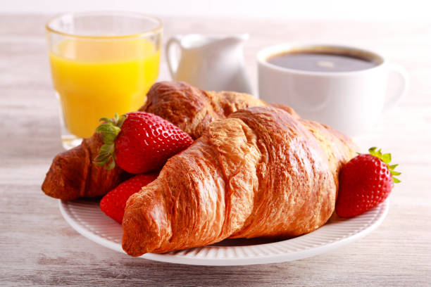 istock Breakfast set with croissants, orange juice 1489457740