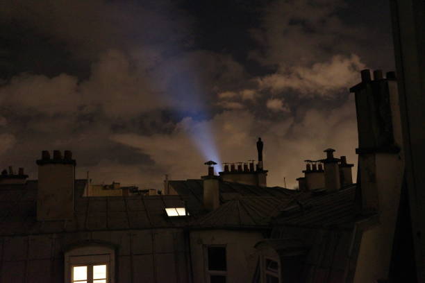 Parisian building silhouettes with background illumination stock photo