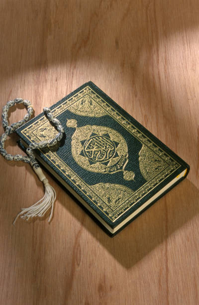 istock Koran book close up on wooden background 1489463103