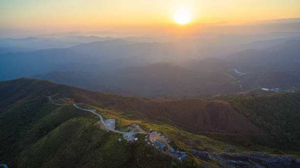 istock aerial view long curve road on the peak in sunset 1489463253