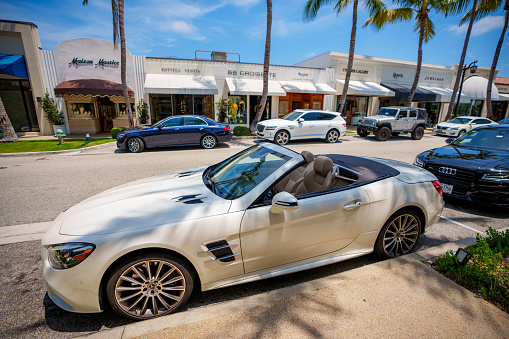 Palm Beach, FL, USA - May 11, 2023: Luxury Mercedes convertible parked on Worth venue