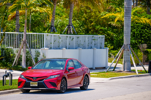 Palm Beach, FL, USA - May 11, 2023: Photo of a red Toyota Camry