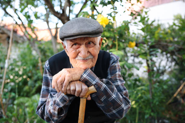 istock Elderly man sitting on a chair 1489466845