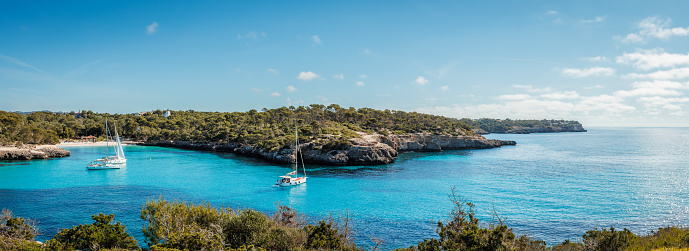Cala Mondrago bay with beach and blue sea at Mallorca. Idyllic vacation and travel destination at Balearic islands. Panoramic view
