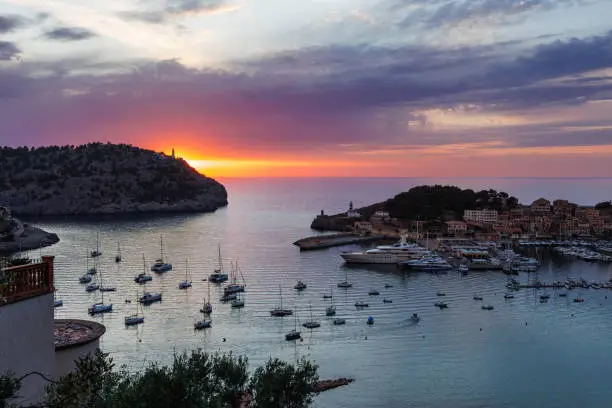 Sunset over Puerto de Soller, Mallorca, Spain. Famous harbor and tourist resort in Balearic islands