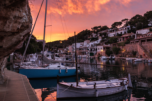 Port de Cala Figuera with ships and boats during sunset. Idyllic fishing village of travel destination in Mallorca, Spain