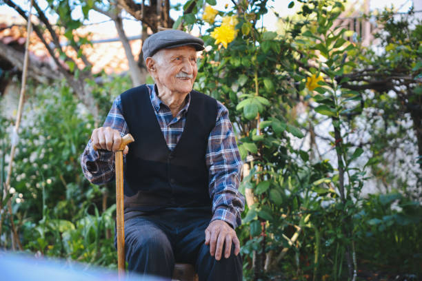 istock Elderly man sitting on a chair 1489467484