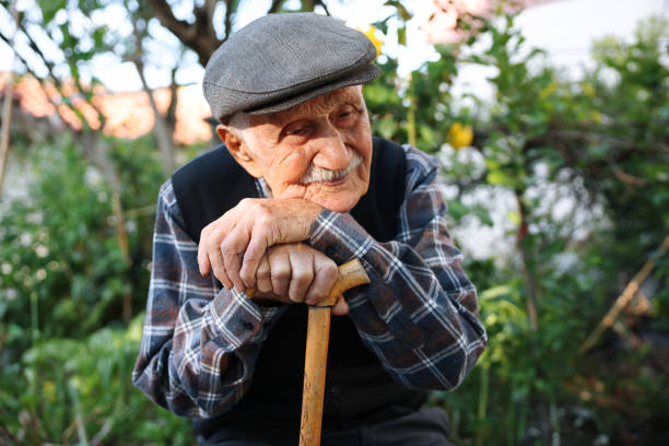 istock Elderly man sitting on a chair 1489468313