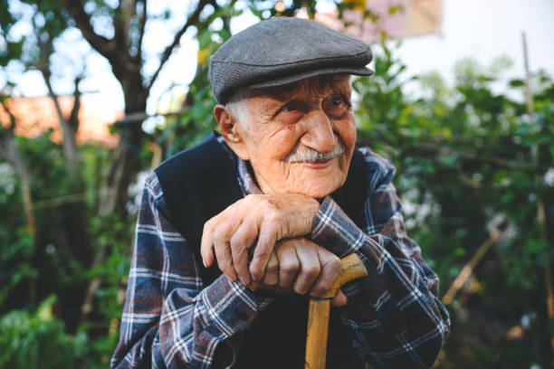 istock Elderly man sitting on a chair 1489468616