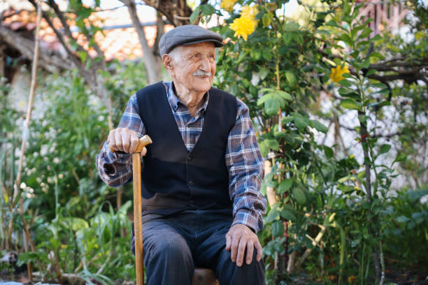 istock Elderly man sitting on a chair 1489468926