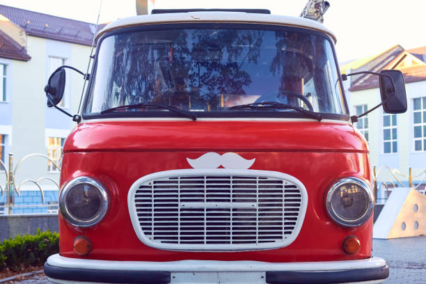 Vintage red car with white grille with white mustache