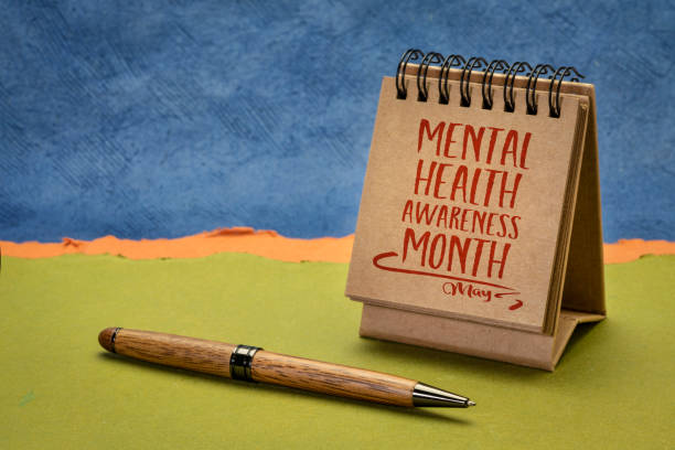 mental health awareness month, May - a note in a desktop calendar stock photo