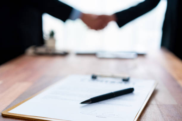 istock Focus table top view of contract document on meeting table. Jubilant 1489472729