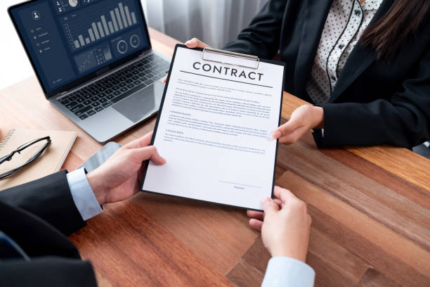 istock Businessman review agreement document before signing contract. Jubilant 1489472787