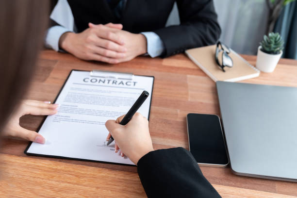 istock Successful agreement between two business partnership with signature. Jubilant 1489472841