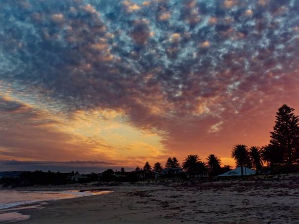 istock Stunning sunset over a beach on a cloudy day 1489472934