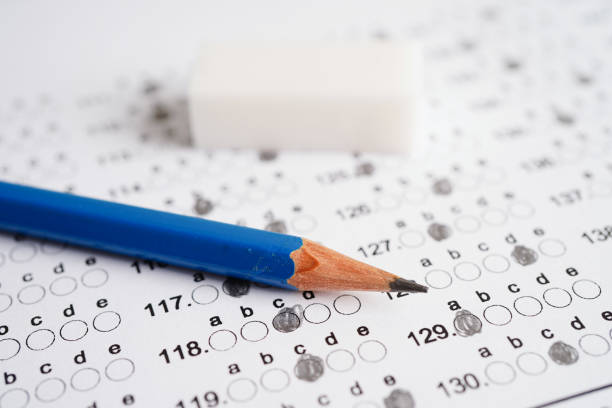 istock Answer sheets with pencil drawing fill to select choice, education concept. 1489473060