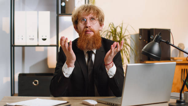 istock Excited amazed businessman looking shocked surprised wow showing hands brain head explosion gesture 1489473752