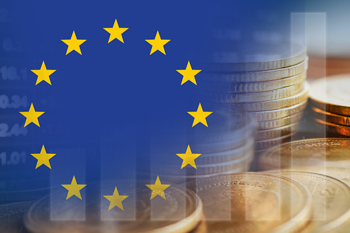 European Union EU flag with stock market finance, economy trend graph digital technology.