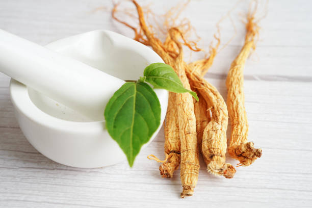istock Ginseng roots and green leaf, healthy food. 1489474228
