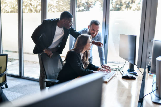 istock Senior African Software Architect Addressing Mistakes Made By Female Trainee 1489475196