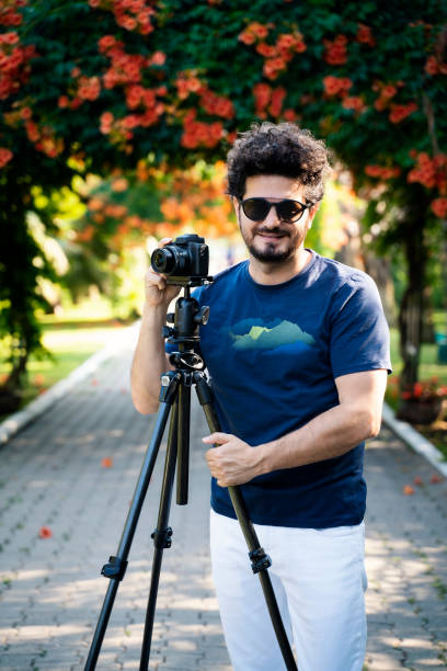 istock Professional photographer preparing for a photo shoot 1489476420
