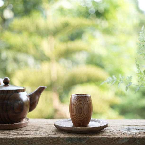 istock wooden small tea cup and earthenware pot on wooden table outdoor drinking 1489477511