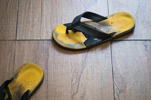 Old yellow sandals, yellow flip-flops