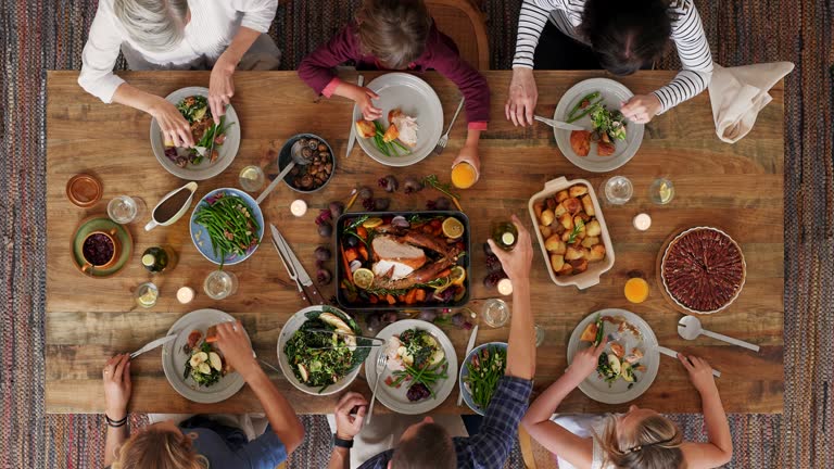 above view of family preparing table enjoying thanksgiving meal together tasty homemade lunch time lapse