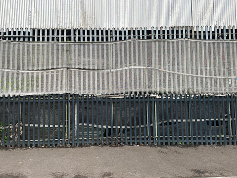 Fence outside a scaffolding warehouse in east London