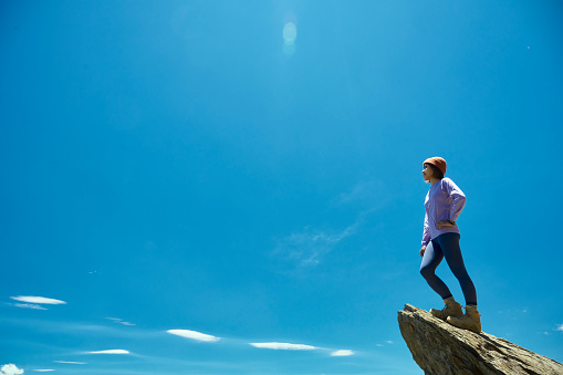 Hiker on the top of the mountain peak.