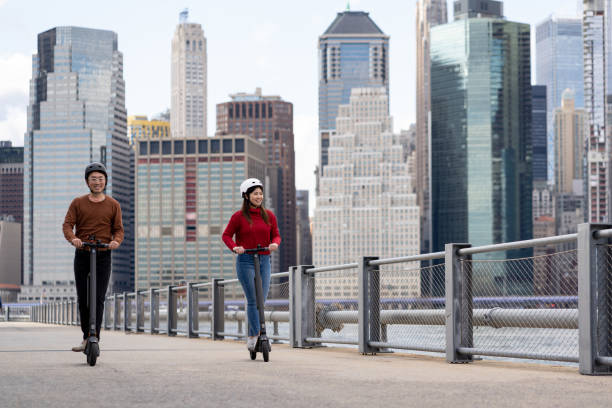 istock Asian friends using electric scooter in NYC 1489495293