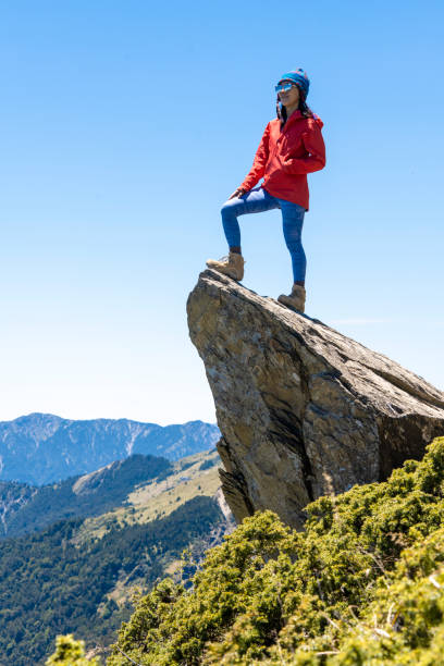 Hiker on the top of the mountain peak.
