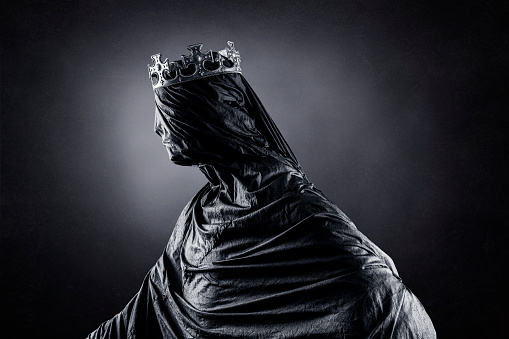 Ghost of a queen or king over dark misty background