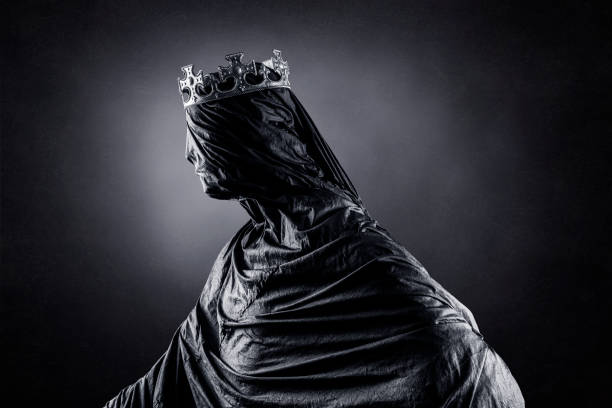 Ghost of a queen or king over dark misty background stock photo