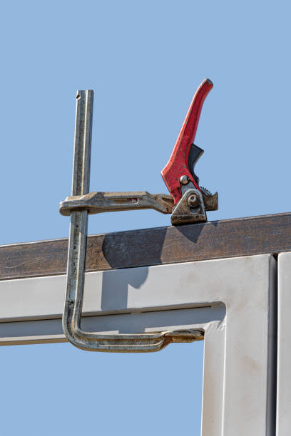 istock Clamp in work with a metal profile. 1489498243
