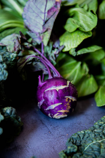 istock Raw Purple kohlrabi on a gray surface with other vegetables around 1489498467