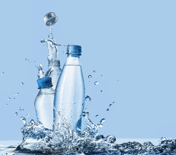 istock Plastic drinking water bottles and water splashes 1489498511