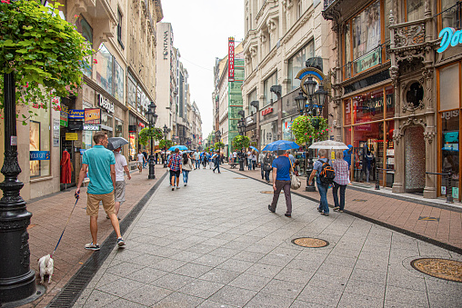 Budapest, Hungary - September 17, 2016: Vaci street with tourists in Budapest, Hungary. On Vaci street in Budapest has collected a huge number of shops, boutiques, cafes and restaurants.