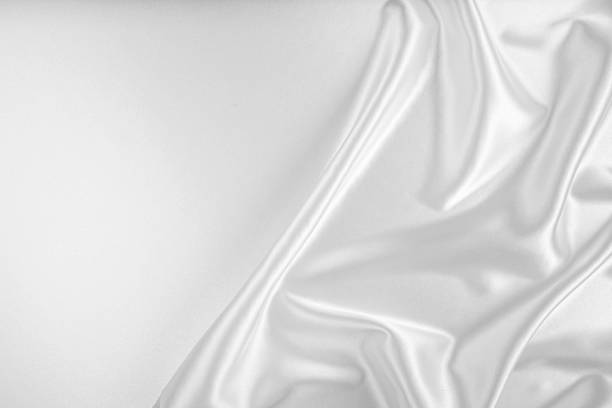 istock Closeup of rippled white silk fabric. 1489501070