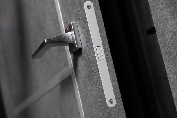 istock modern and secured metal door handle and latch detail 1489501833