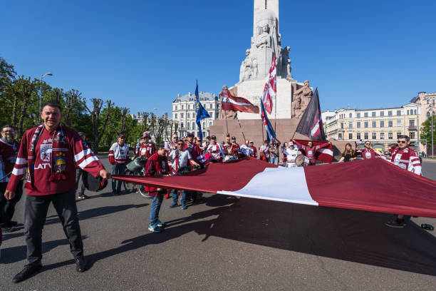 Latvian ice hockey fans at the Freedom Monument stock photo