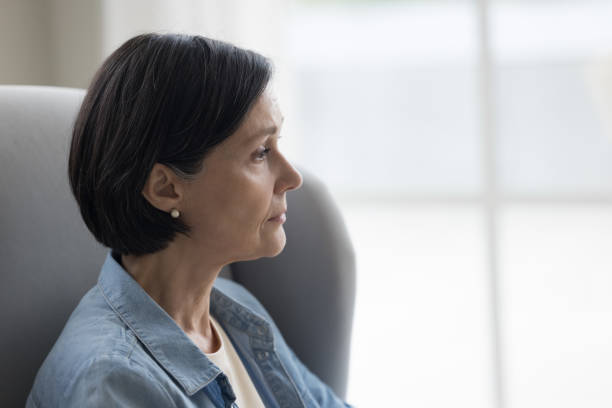istock Sad mature black haired woman looking away in deep thoughts 1489504296