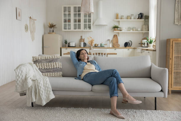 istock Calm sleepy middle aged woman resting on soft couch 1489504308